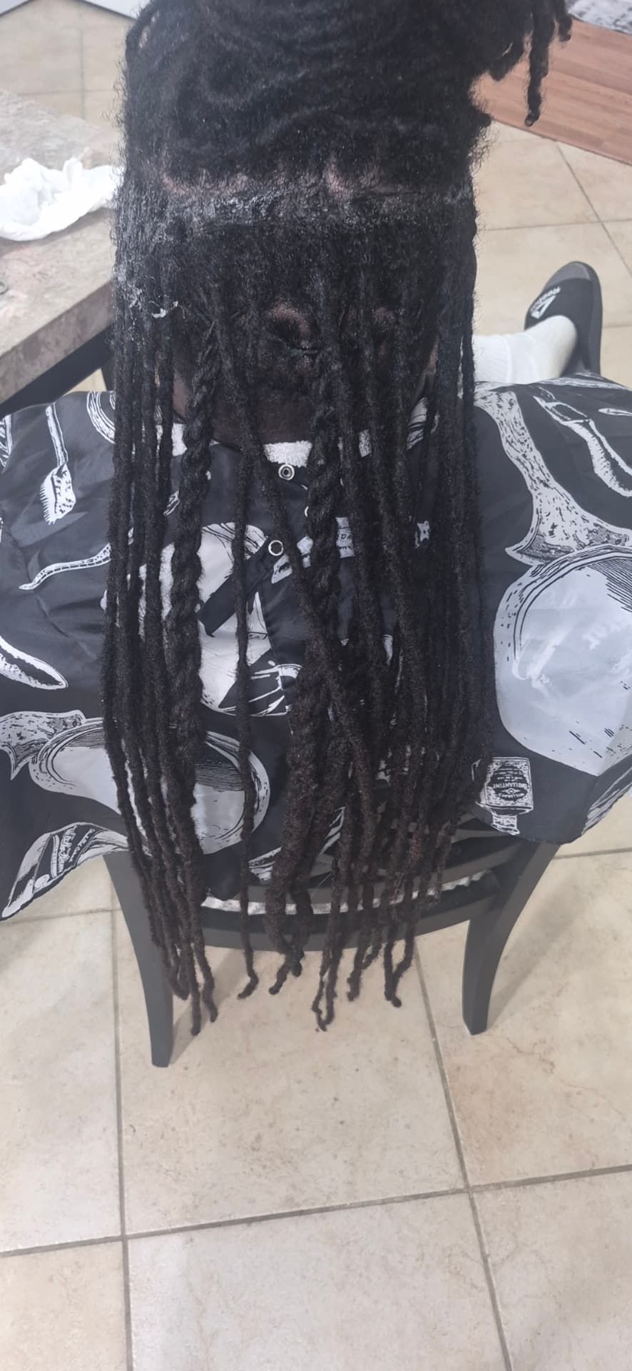 Full-length locs freshly retwisted during an in-home appointment